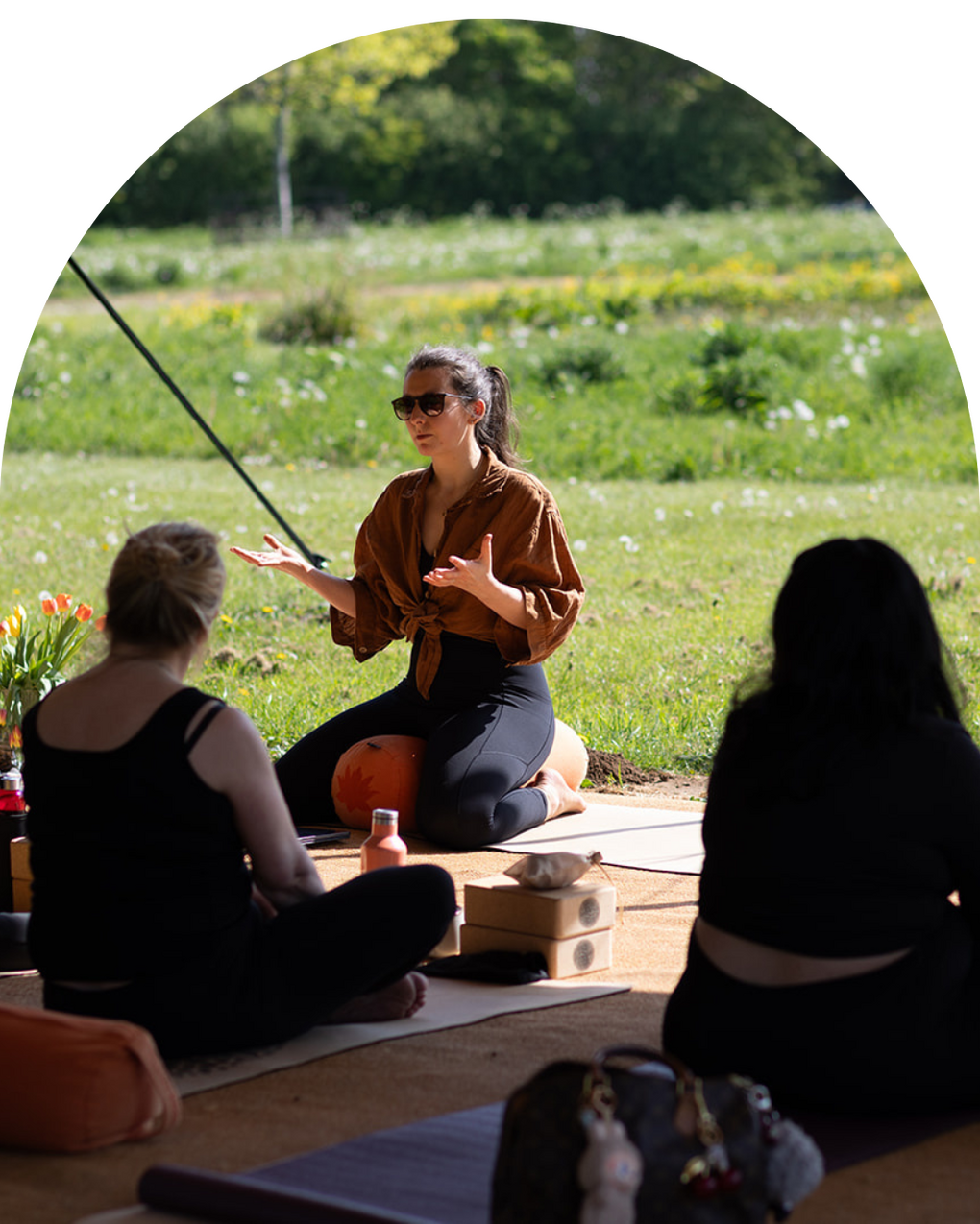 Bronwyn Benstead in a sunny field running a yoga session