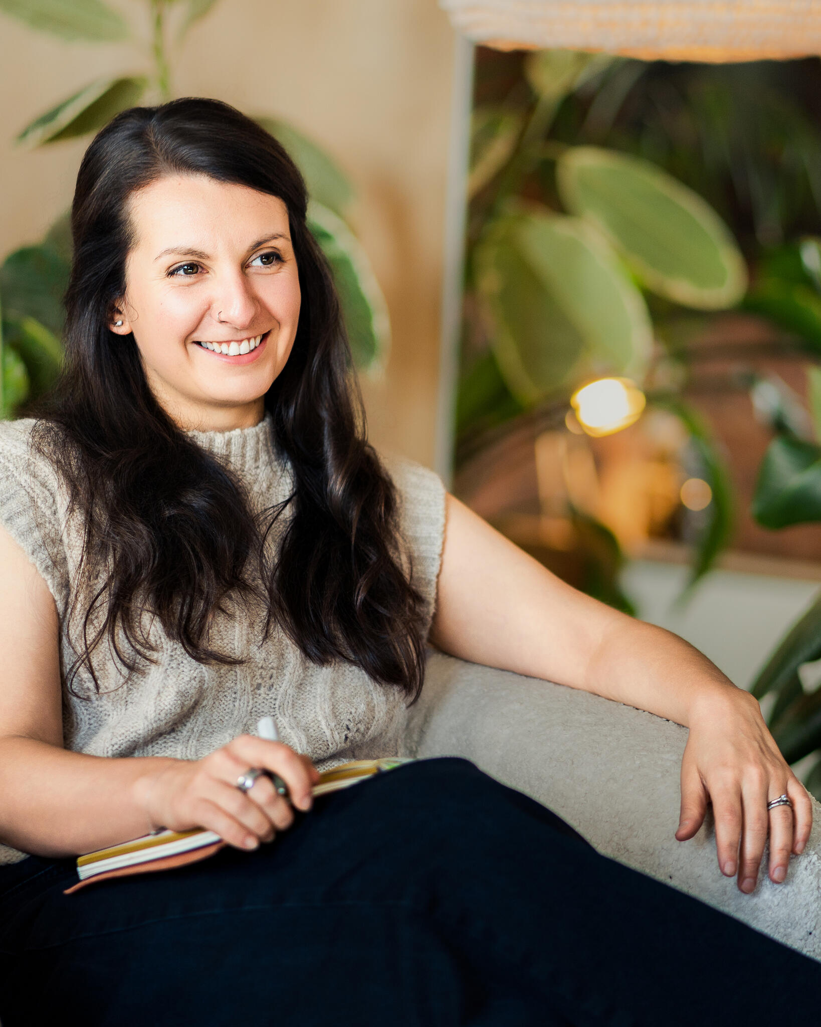 Image of Bronwyn Benstead sat in a chair listening to a coaching client